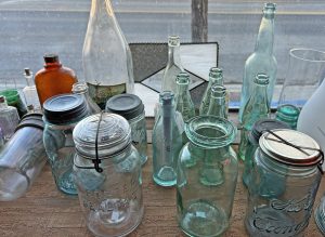 Photo of items for sale at Fly Trap Antiques: one of Callie's favorite things to collect: old bottles, jars and glass. Lots to choose from!