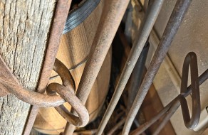 Branding irons (some hand-wrought) and a single tree (oxen harness).